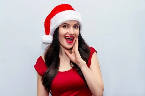 Close up Christmas Photo of Impressed Girl with Screaming Wow OMG in Santa Hat Stock Photos
