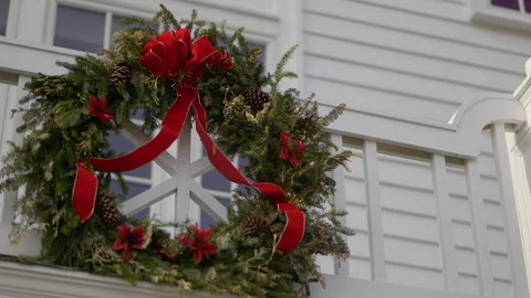 Close up Christmas reef red bow hanging on balcony 스톡 동영상 170381459