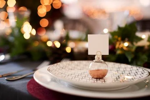 Close up of Christmas table setting with bauble name card holder arranged on Stock Photos