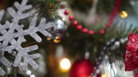 Close-up Christmas tree with beads, balls, shape of snowflake, bow and garland. Stock Footage 219547935