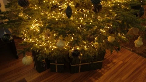 Close up of a Christmas tree decorated with balls and a gifts under it. Stock Footage 165341516