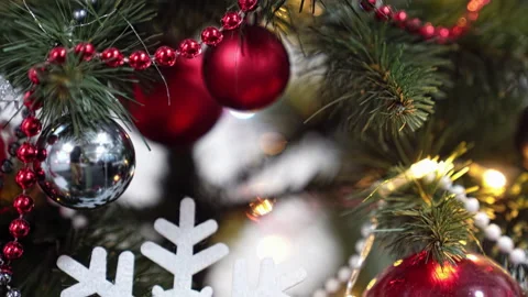 Close-up, Christmas tree decorations, balls, beads, snowflake shape and garland Stock Footage 219546598