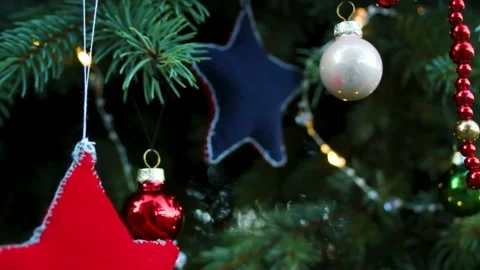 Close-up of Christmas tree decorations on a Christmas tree with the camera Stock Footage 296401905
