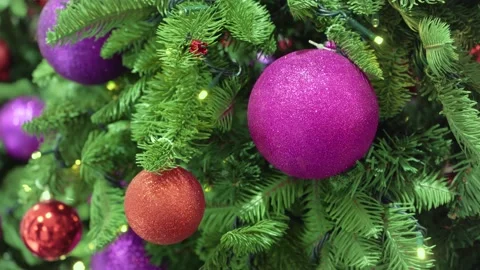 Close-up of Christmas tree with large balls and burning lights Video stock 144961444