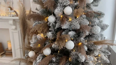 Close up Christmas Tree with lights and balls in beige, gold and white Stock Footage 225514066