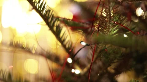 A Close Up Of A Christmas Tree With Lights And Golden Bokeh Stock Footage 313710109