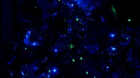 Close up of christmas tree lights flashing Stock Footage 99775977