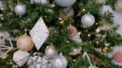 Close up a Christmas tree lights glittering at night. New Year fir tree with Stock Footage 120319948