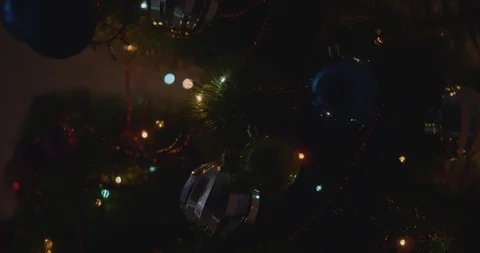 Close Up A Christmas Tree Lights Glittering At Night. New Year Fir Tree Stock Footage 123335809