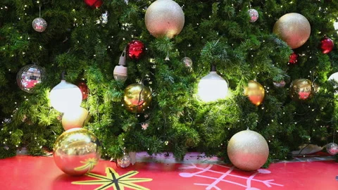 Close up a Christmas tree lights glittering at night. New Year fir tree with dec Stock Footage 145299960