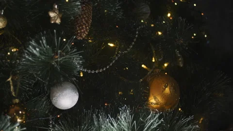 Close up a Christmas tree lights glittering at night. New Year fir tree with Stock Footage 160921643