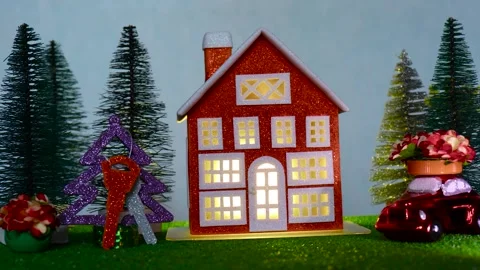 Close-up of a Christmas tree with multi-colored keys near a red house Stock Footage 265013065