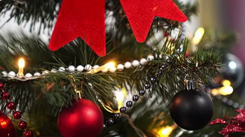Close-up, Christmas tree with a red bow, beads, balls, shape of snowflake. Stock Footage 219547093