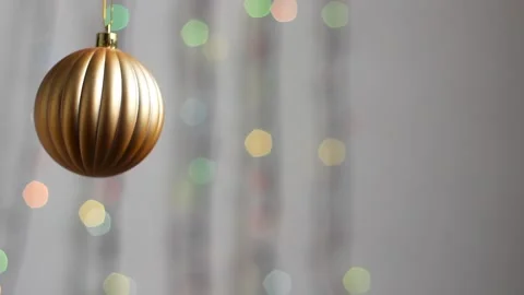 Close-up. Christmas tree toy in the form of a sphere of gold color. Stock Footage 143003473