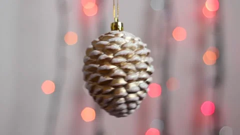 Close-up. Christmas tree toy in the form of a fir cone. Video stock 143003582