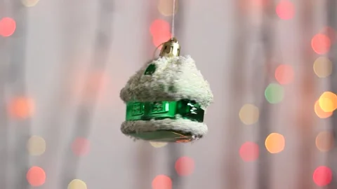 Close-up. Christmas tree toy in the form of a green house. Stock Footage 143003600