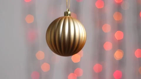 Close-up. Christmas tree toy in the form of a sphere of gold color. Stock Footage 143378946