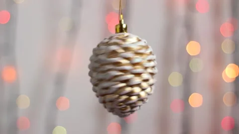 Close-up. Christmas tree toy in the form of a fir cone. Stock Footage 143587465