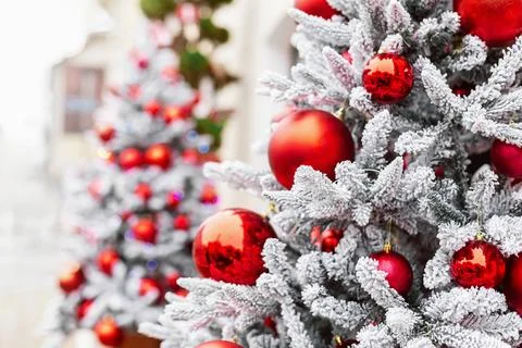 Close-up of a Christmas tree's decorations, featuring red baubles and glowi.. Stock Photos