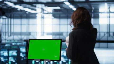 Close up of chroma key tablet and teamworking programmers in server room Stock Photos