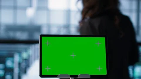 Close up of chroma key tablet and teamworking programmers in server room Stock Photos