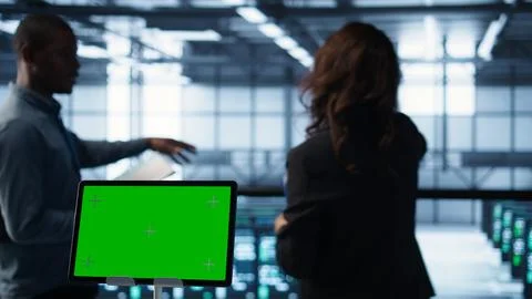 Close up of chroma key tablet next to server room data scientists 写真素材