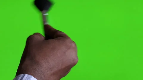 Close chroma shot of a hand making strokes with a brush, painting Stock Footage 147114458