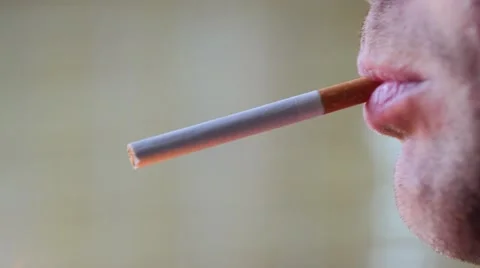 Close up of a cigarette being lightened by man Stock Footage 51680067