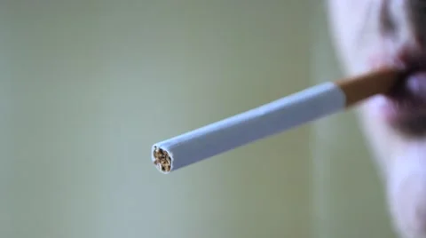 Close up of a cigarette being lightened by man Stock Footage 51680169