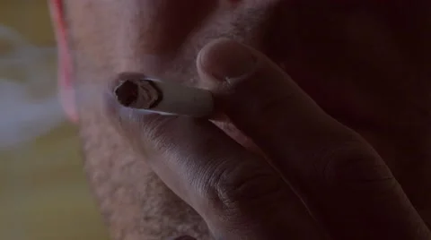 Close up of a cigarette being lightened by man Stock Footage 51886628