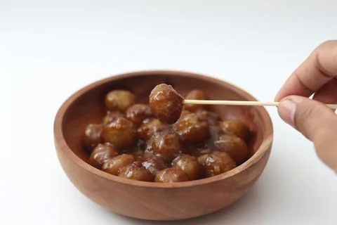 A close up of cilok. Made from tapioca flour and a delicious peanut sauce. .. Stock Photos