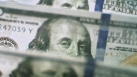 Close-up cinematic motion of dollar banknotes, a stack of one hundred dolla.. Stock Footage 337519184