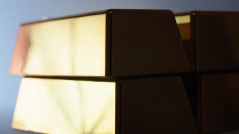 Close-Up Cinematic Pan Along Large Stack of Gold Bars Stock Footage 328257965