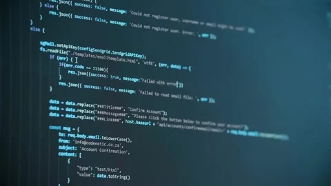Close-up cinematic shot of a computer screen displaying lines of code being Stock Footage 333936299