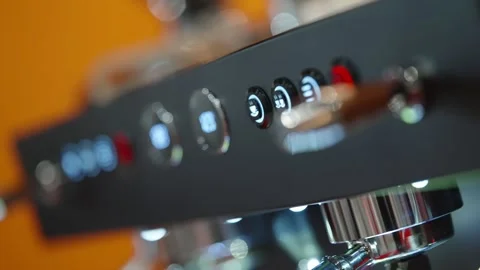 Close-up cinematic view of a modern stainless-steel espresso machine control Stock Footage 325671763