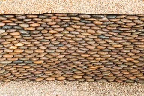 Close up of circle pebble wall,abstract background Stock Photos