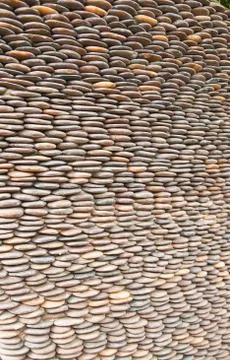Close up of circle pebble wall,abstract background 스톡 사진