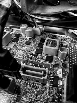 Close up of circuit board with microchips and other computer parts. Cables .. Stock Photos
