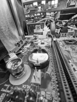 Close up of circuit board with microchips and other computer parts Stock Photos