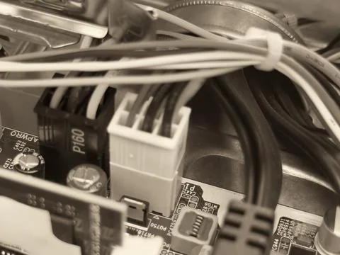 Close up of circuit board with microchips and other computer parts. Power c.. Stock Photos