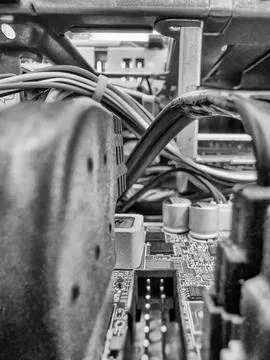 Close up of circuit board with microchips and other computer parts. Cables .. Stock Photos
