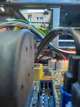 Close up of circuit board with microchips and other computer parts. Cables .. Foto stock