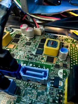 Close up of circuit board with microchips and other computer parts. Cables .. Stock Photos
