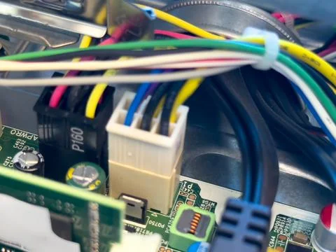 Close up of circuit board with microchips and other computer parts. Power c.. Stock Photos
