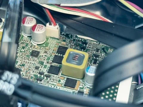 Close up of circuit board with microchips and other computer parts. Cables .. Stockfoto's