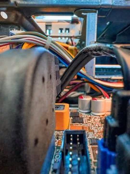 Close up of circuit board with microchips and other computer parts. Cables .. Stock Photos