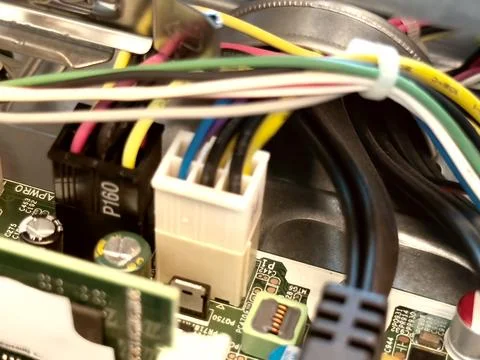 Close up of circuit board with microchips and other computer parts. Power c.. Stock Photos