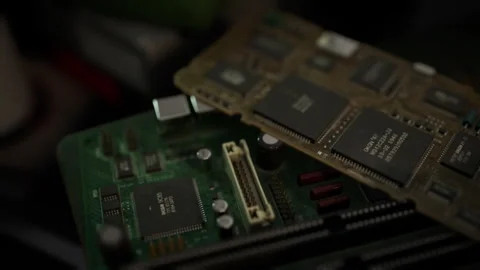 Close up of circuit boards and microchips on a workbench in a tech lab Stock Footage 304467695