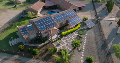 Close-up circular aerial view of a reneweable energy efficient home solar panels Stock Footage 221836445