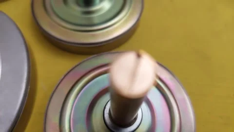 Close-up of circular metal components with a brass pin Stock Footage 336460635